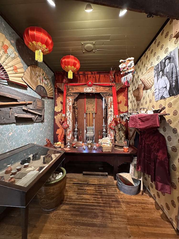 Chinese lanterns, cloth, and photos of early Asian settlers
